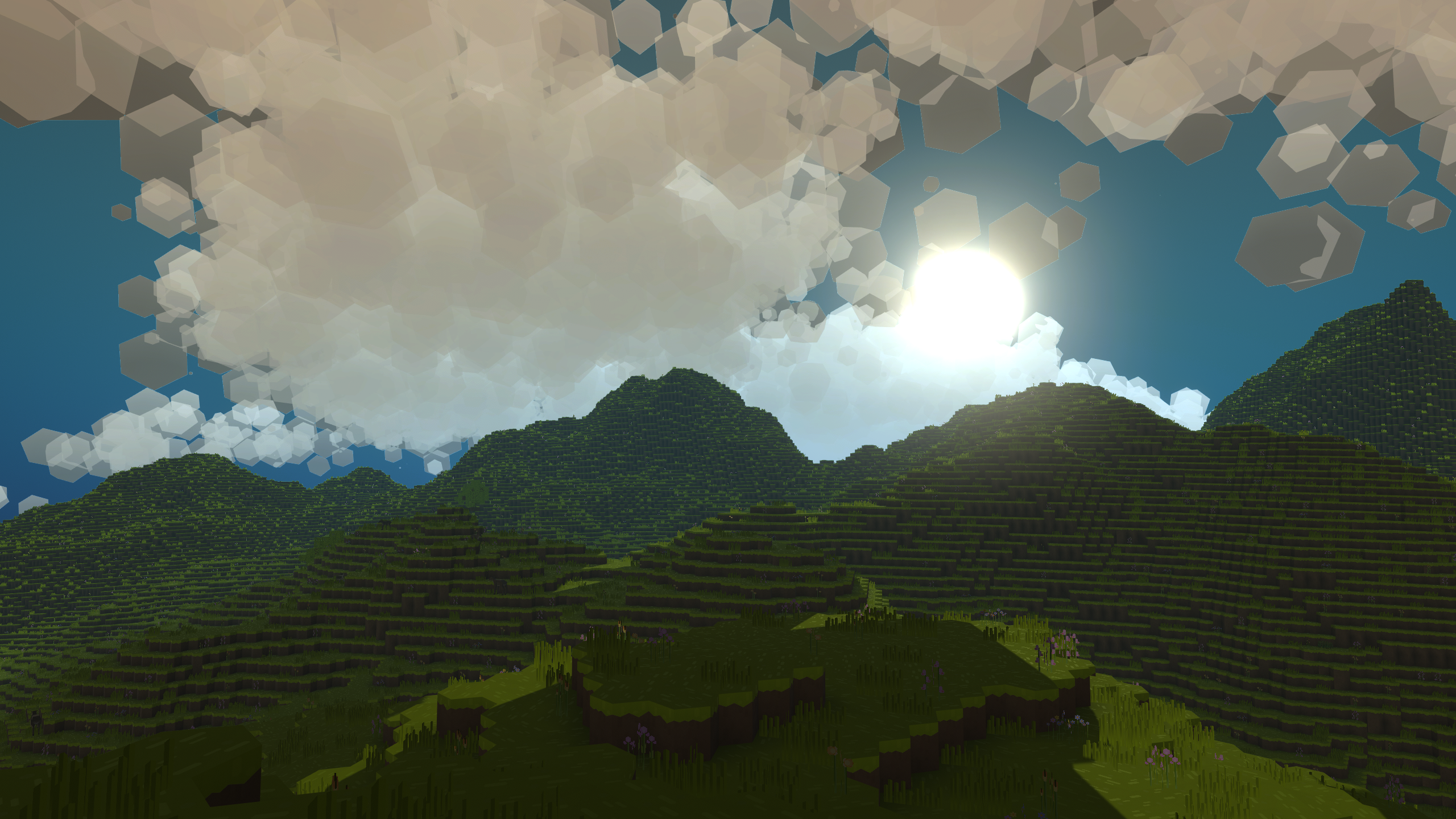 Mountain Clouds An image of PlanetSmith. title: Mountain Clouds, description: Sun shining through cloud above the mountains